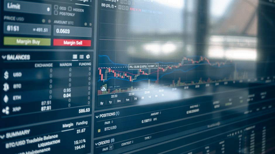 Close-up of a digital screen displaying stock trading graphs and cryptocurrency values. Ideal for finance and technology themes.